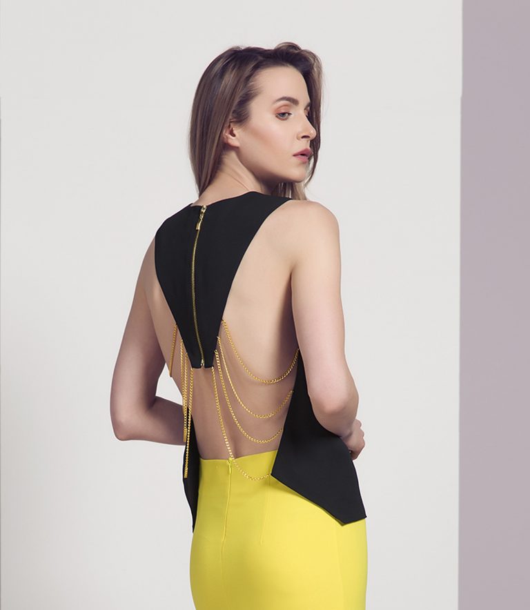 Alila Boutique black and gold chain open back top by Explosion.