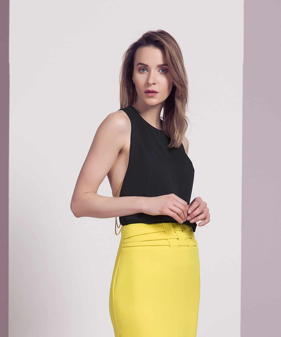 Alila Boutique black and gold chain open back top by Explosion.
